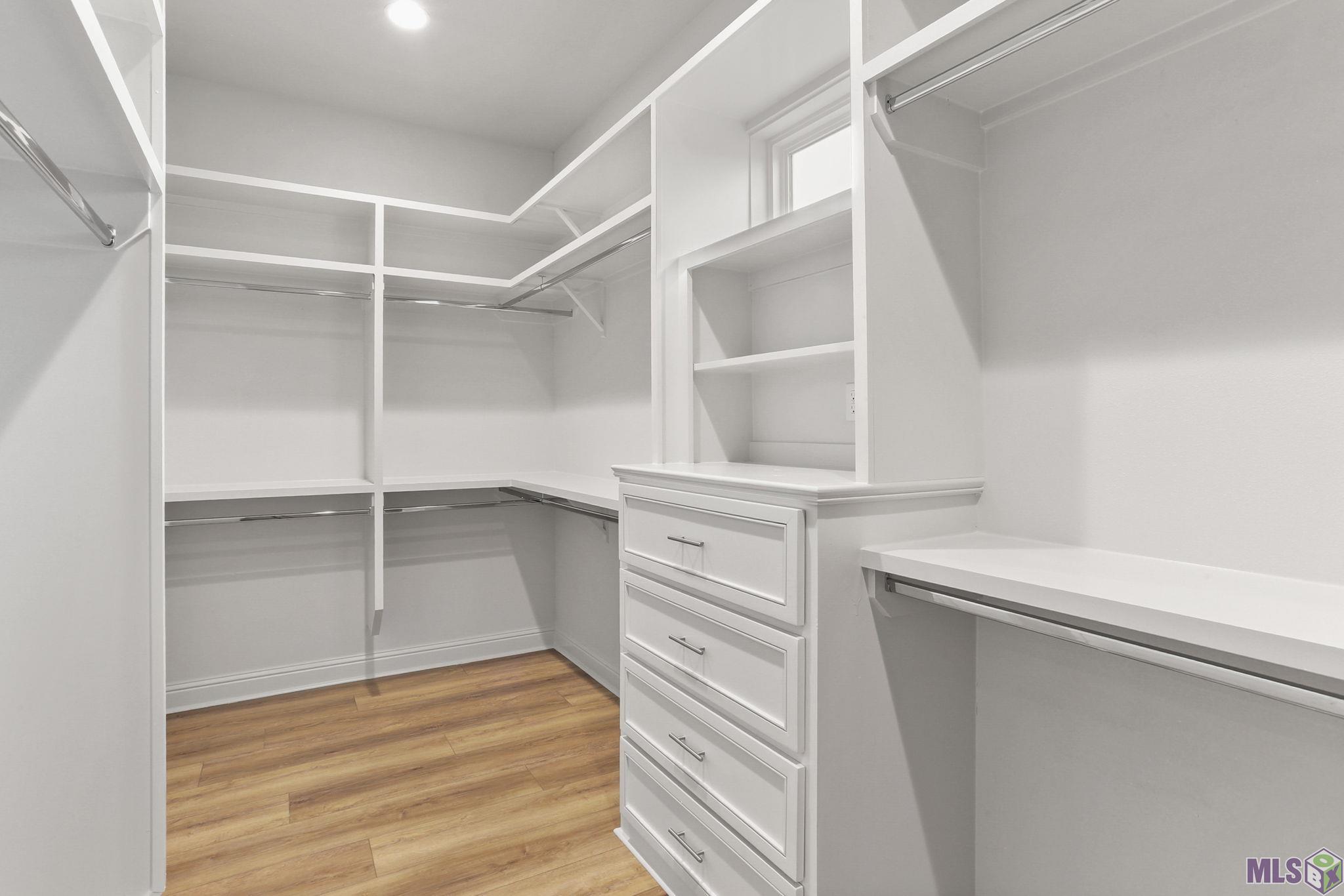 4439 Camargue Avenue Baton Rouge, LA 70820 - Photo 14 of 17 Primary Closet with built-ins