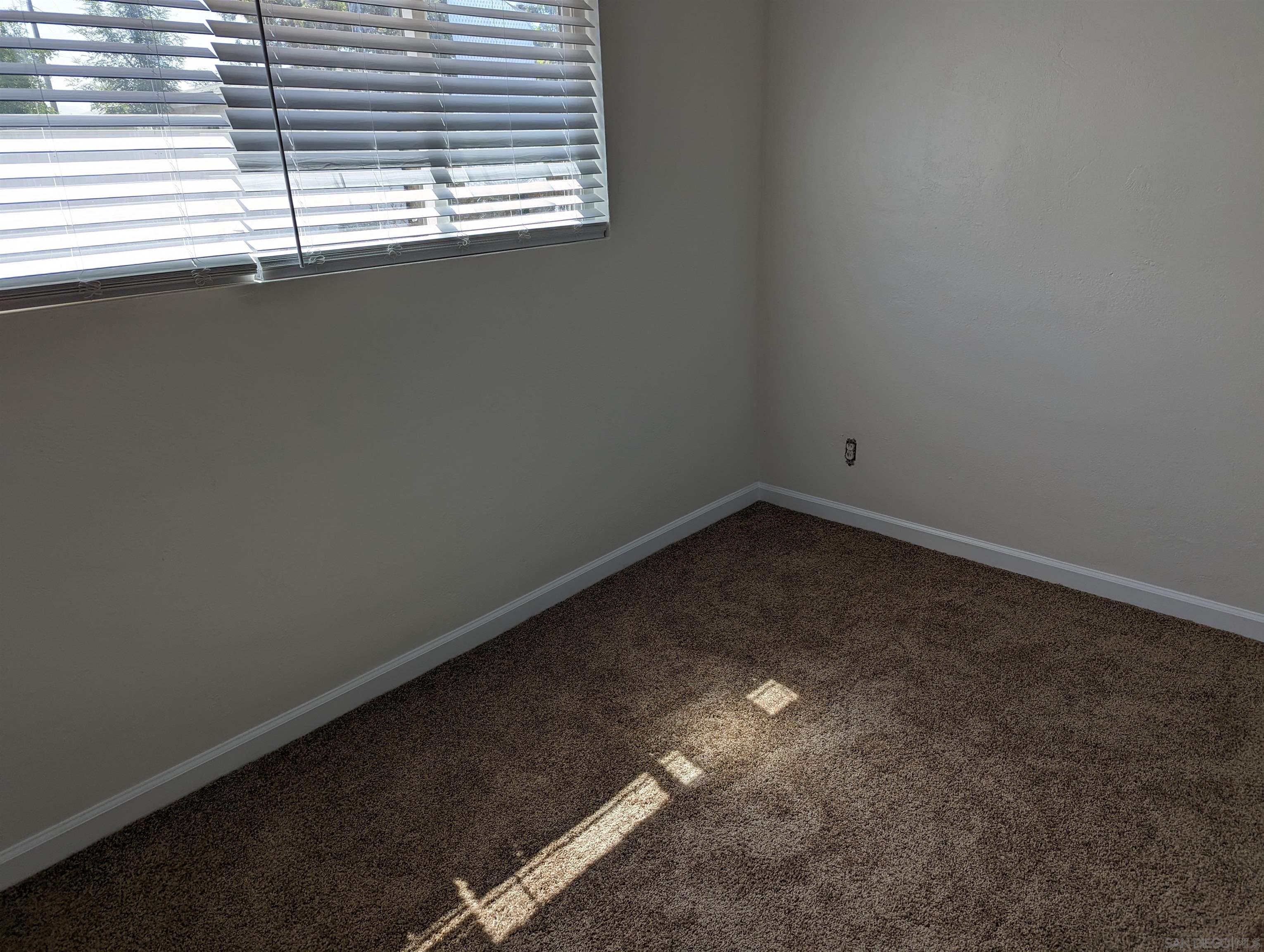 1207 Lyons Lane El Cajon, CA 92021 - Photo 13 of 39 a view of a room that has a window
