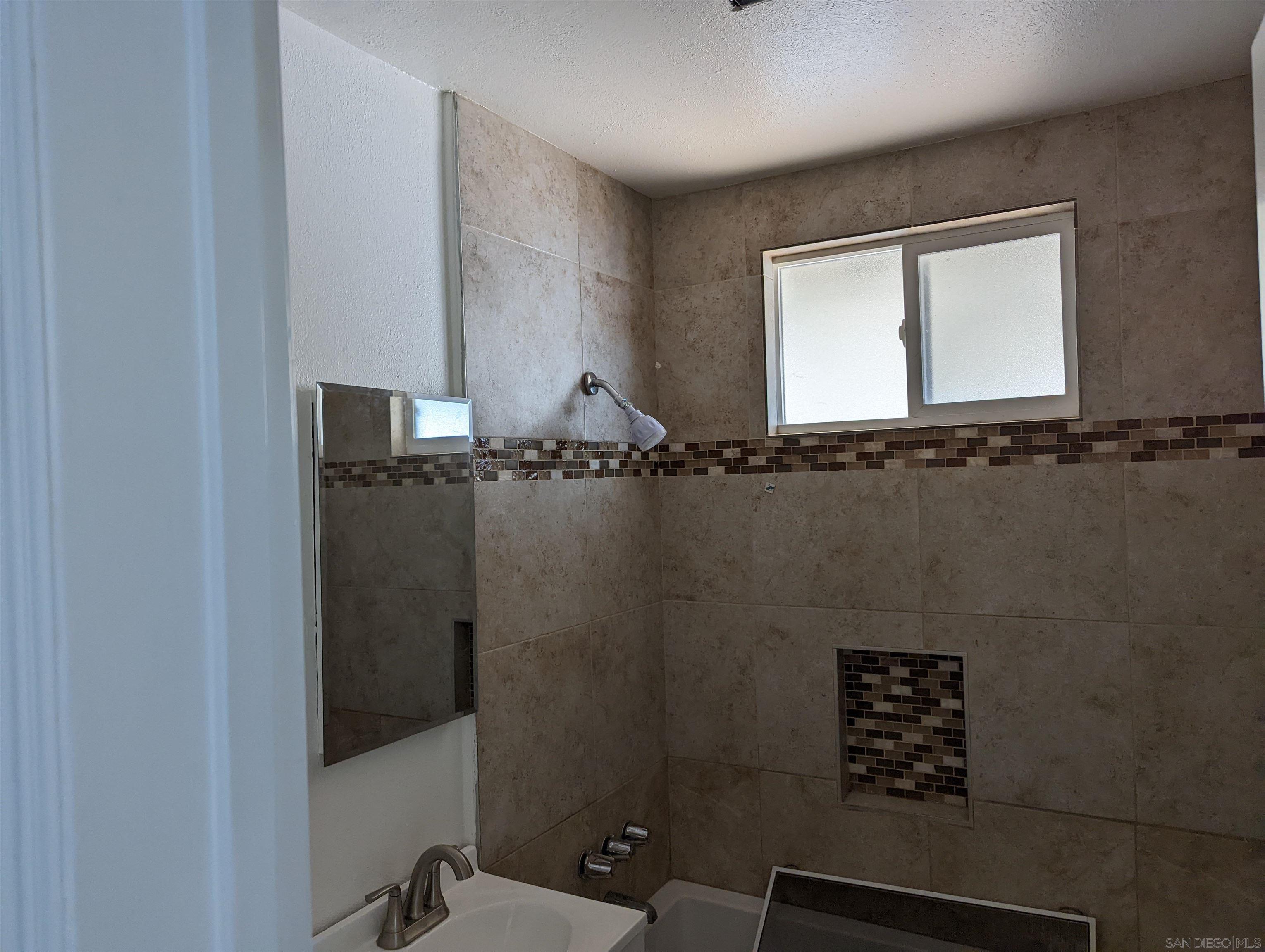 1207 Lyons Lane El Cajon, CA 92021 - Photo 16 of 39 view of a bathroom with a window