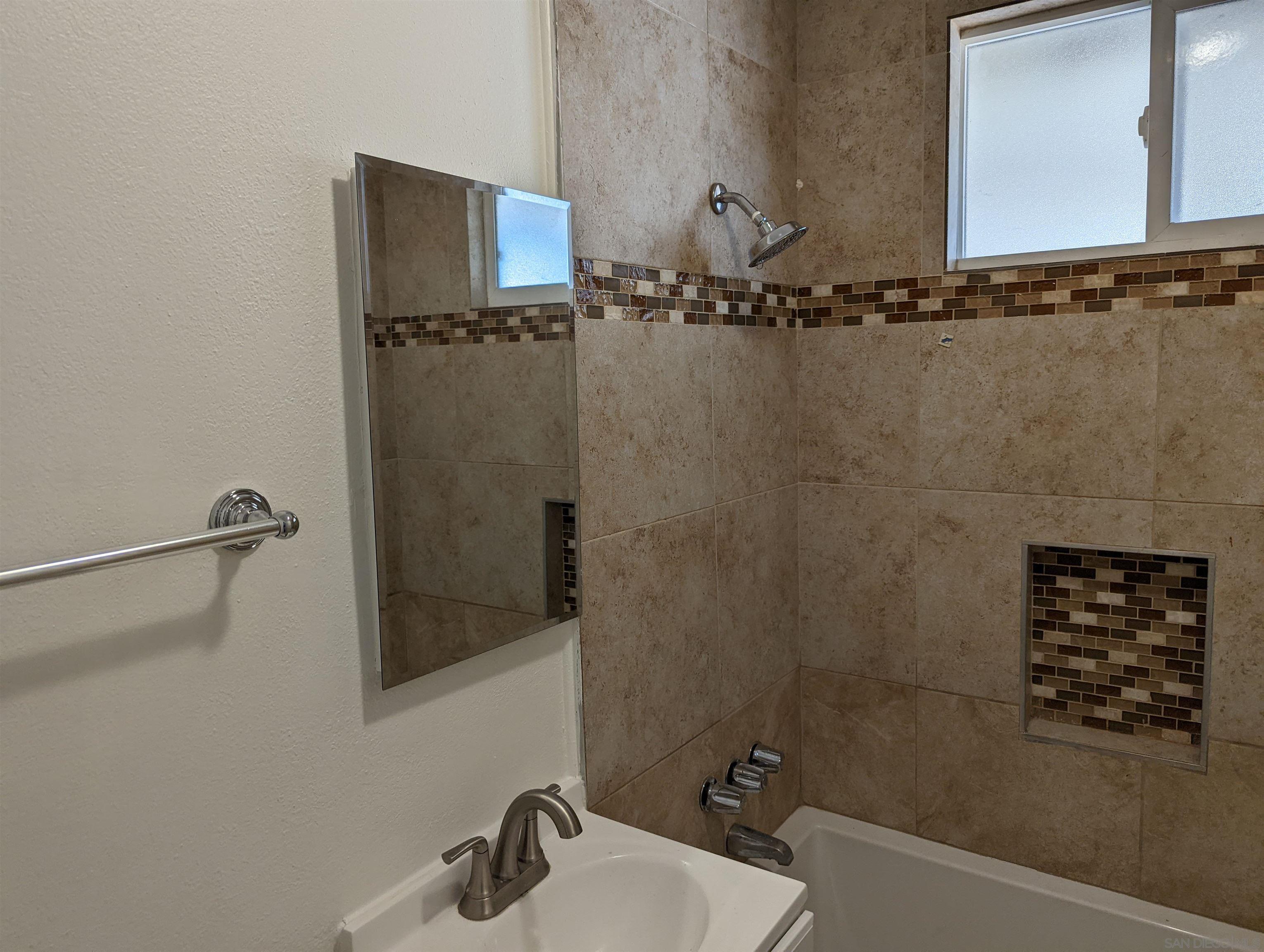 1207 Lyons Lane El Cajon, CA 92021 - Photo 17 of 39 a bathroom with a shower and a sink