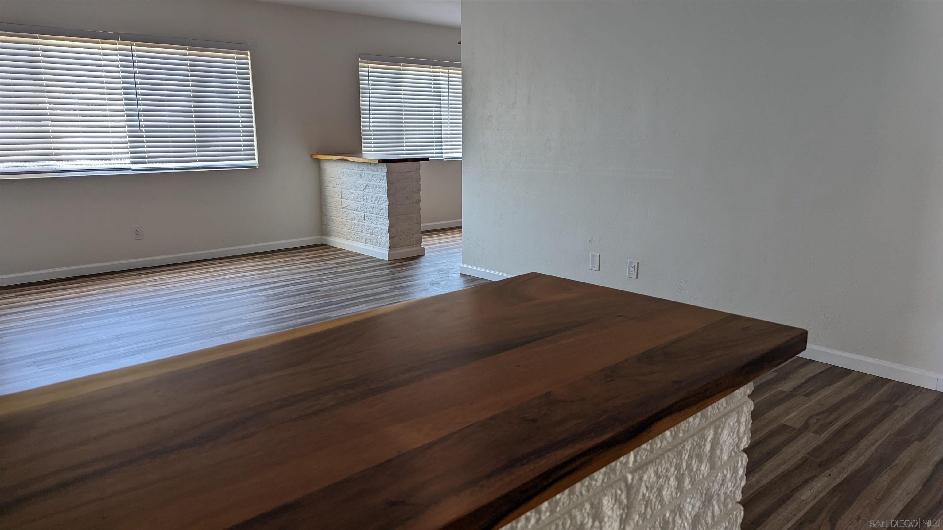 1207 Lyons Lane El Cajon, CA 92021 - Photo 37 of 39 a view of a closet area with wooden floor