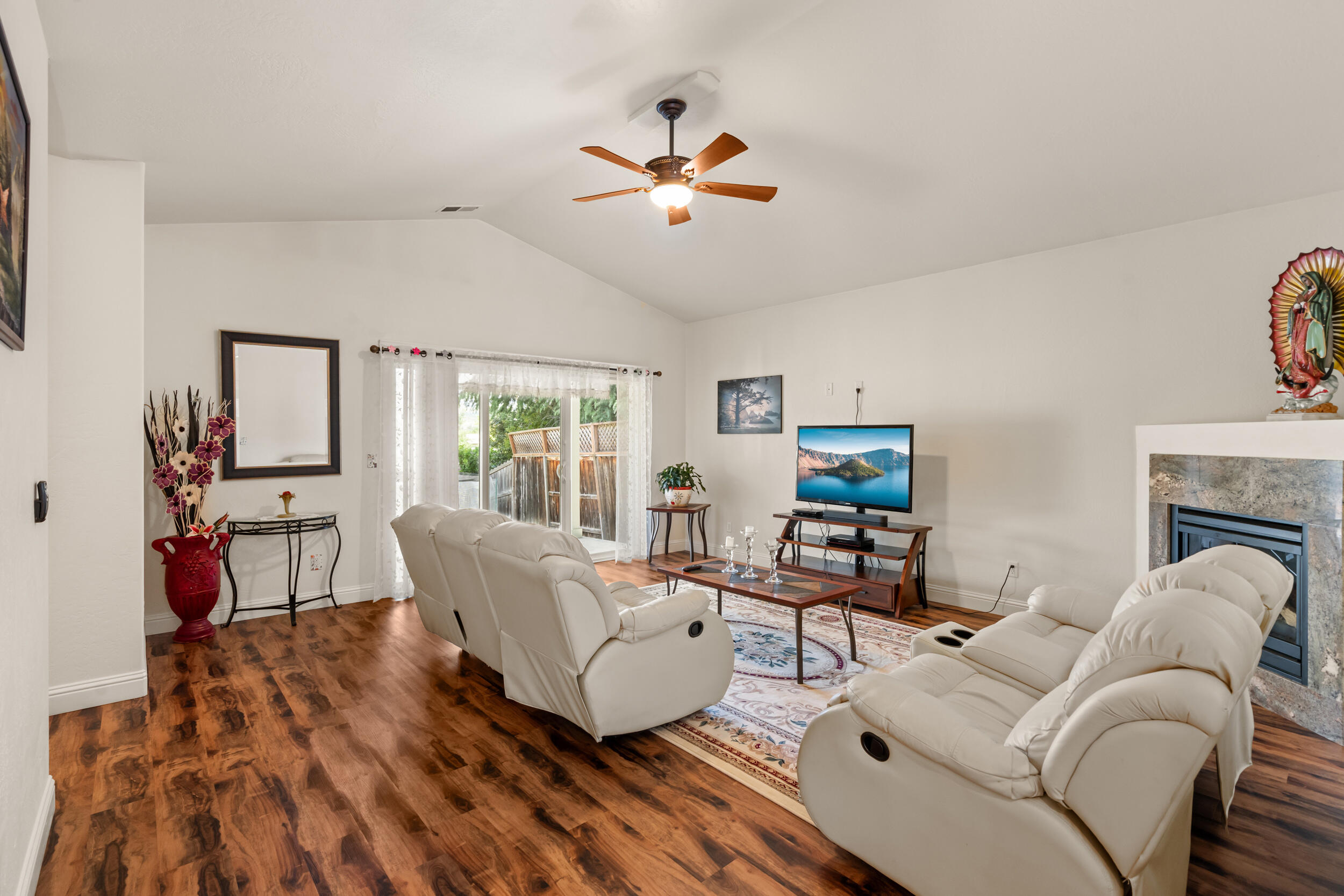 1227 Lithia Way Talent, OR 97540 - Photo 11 of 37 a living room with furniture and a flat screen tv