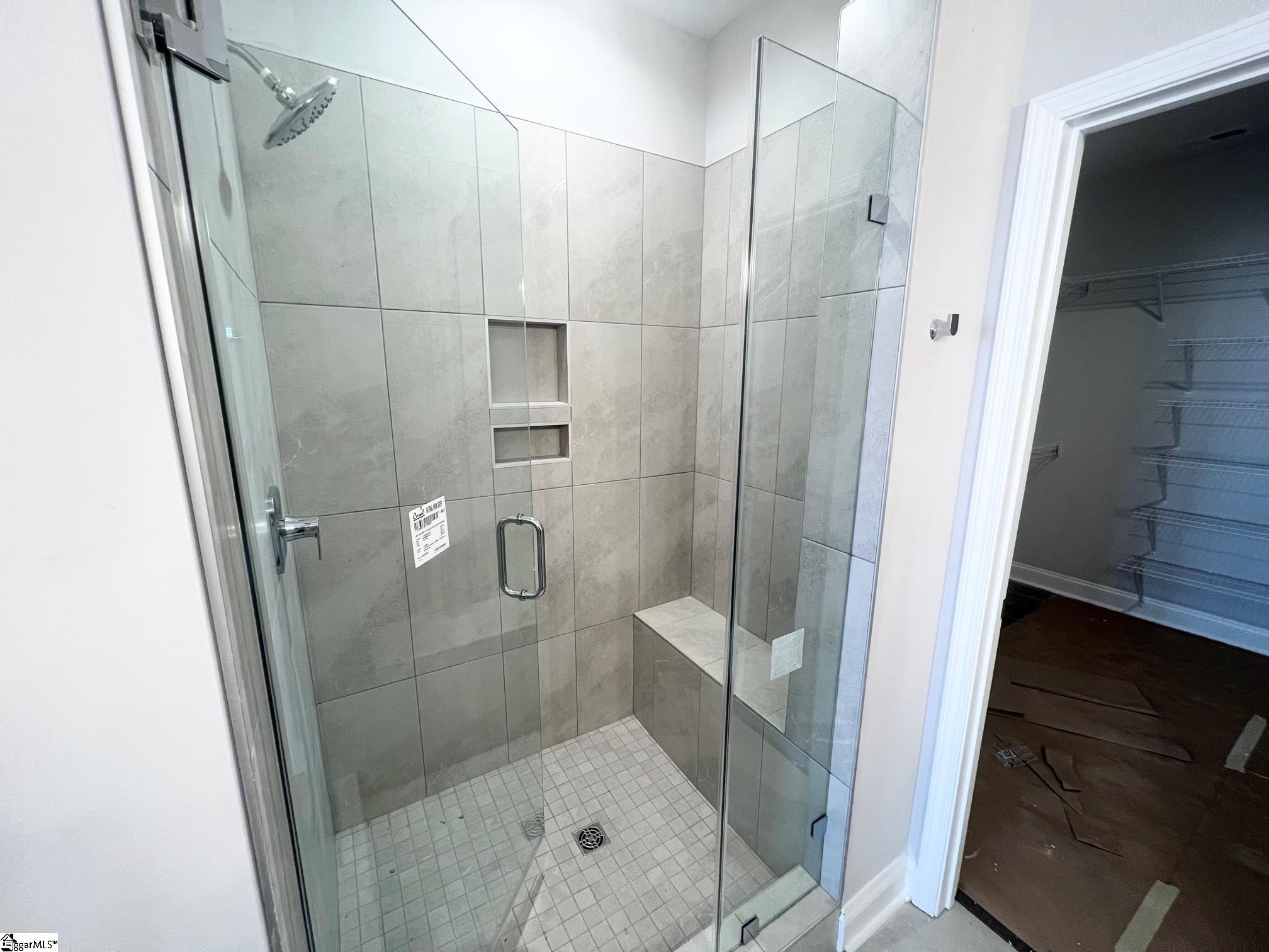 135 Green Heron Road Greenville, SC 29607 - Photo 13 of 26 Frameless shower door, tile seat, soap and shampoo niche