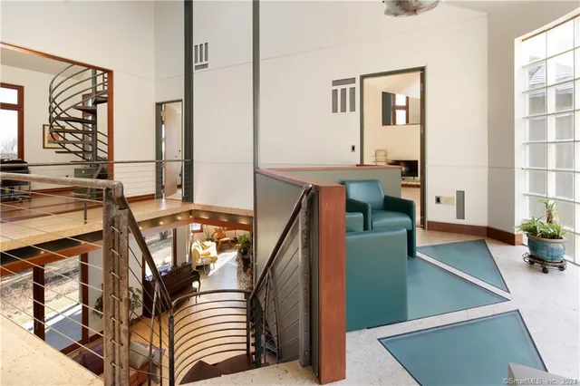 a view of a living room with furniture and window