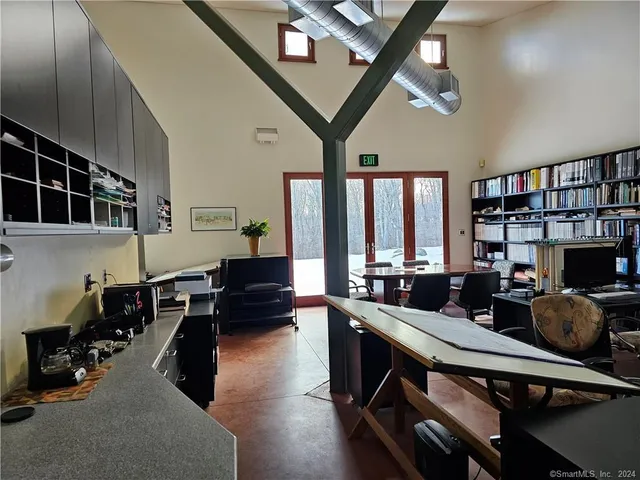 a view of yard with tree and wooden fence