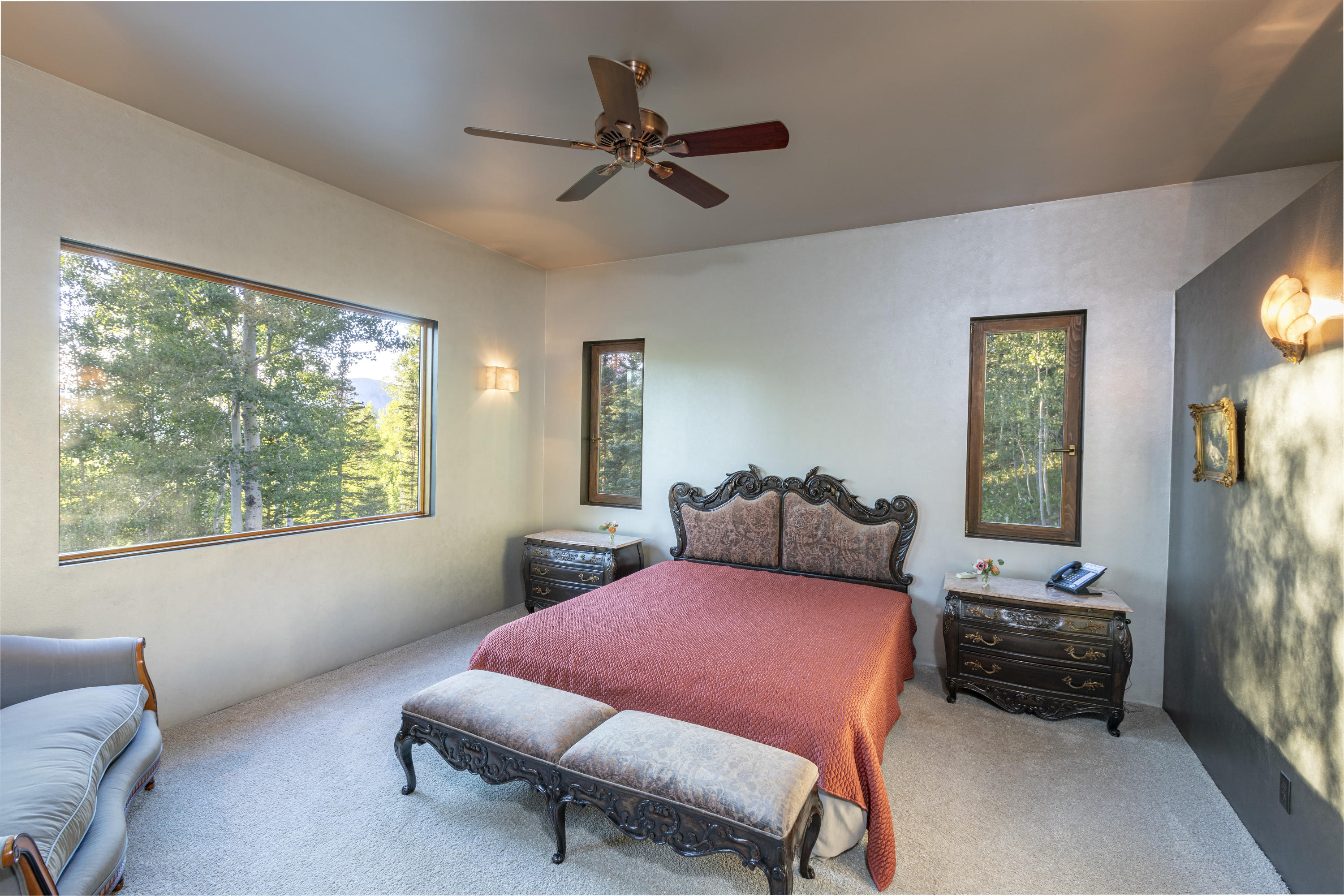 24 Sunset Circle Telluride, CO 81435 - Photo 20 of 39 a bedroom with a bed a couch and a window