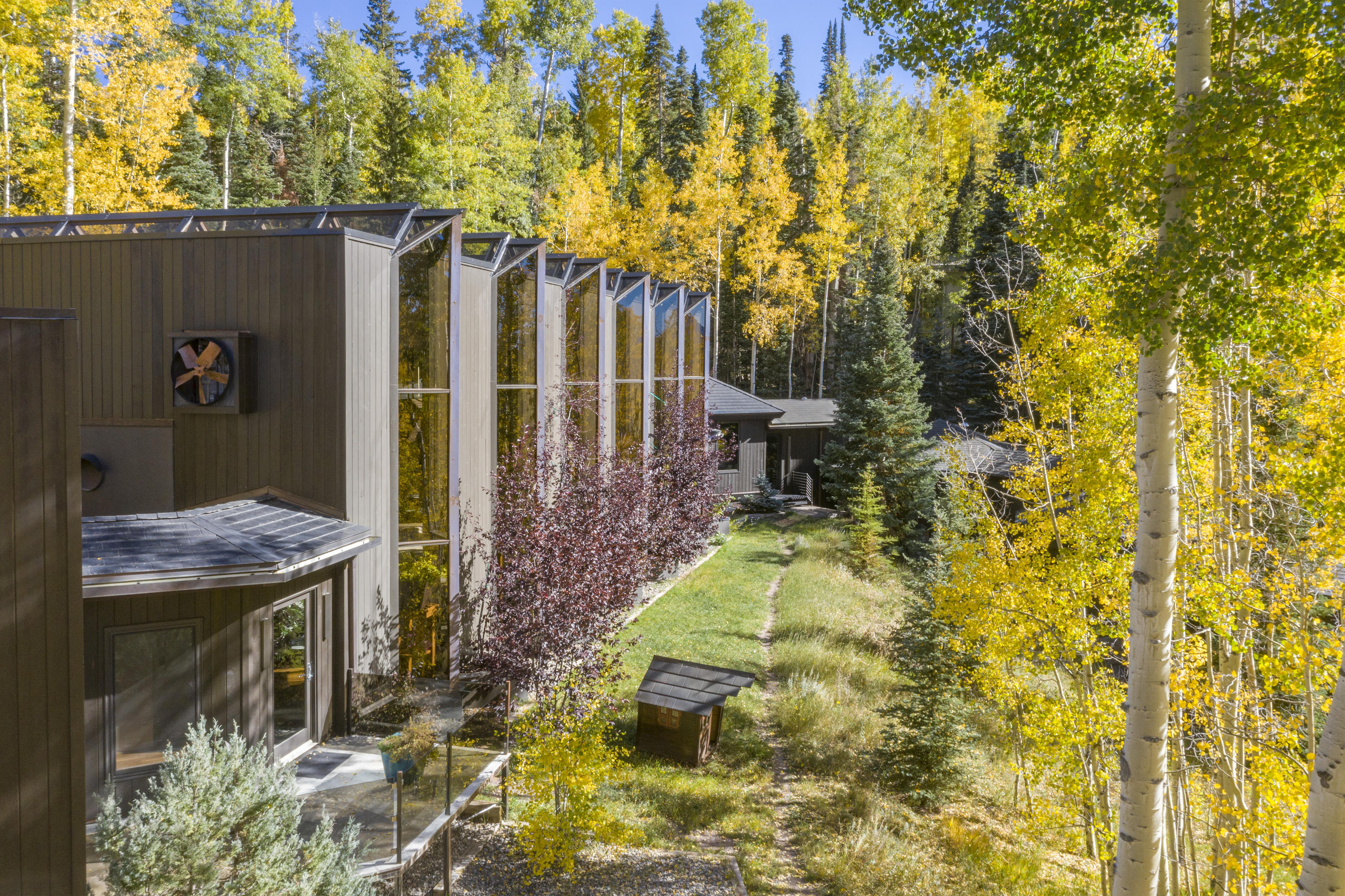 24 Sunset Circle Telluride, CO 81435 - Photo 3 of 39 a backyard of a house with table and chairs