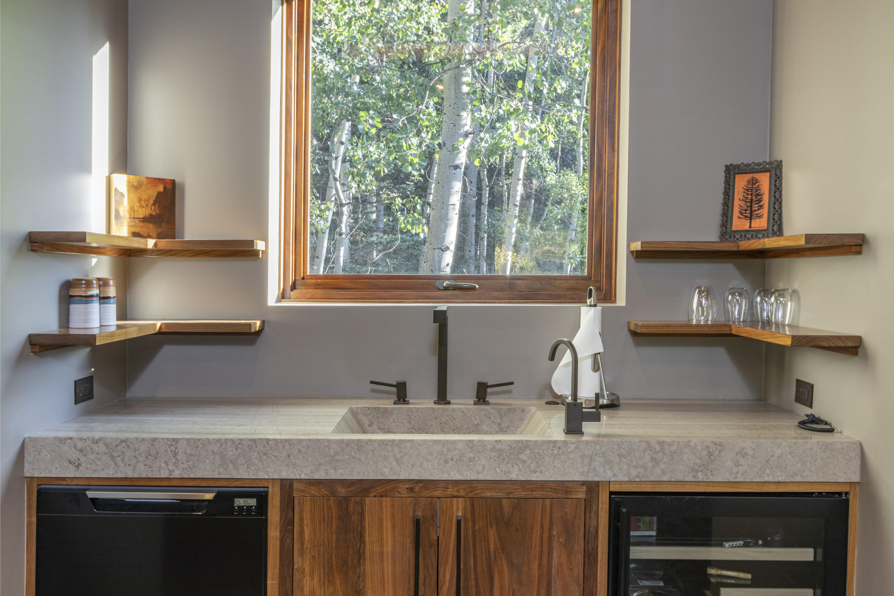 24 Sunset Circle Telluride, CO 81435 - Photo 24 of 39 a kitchen with stainless steel appliances granite countertop a sink a stove and a microwave