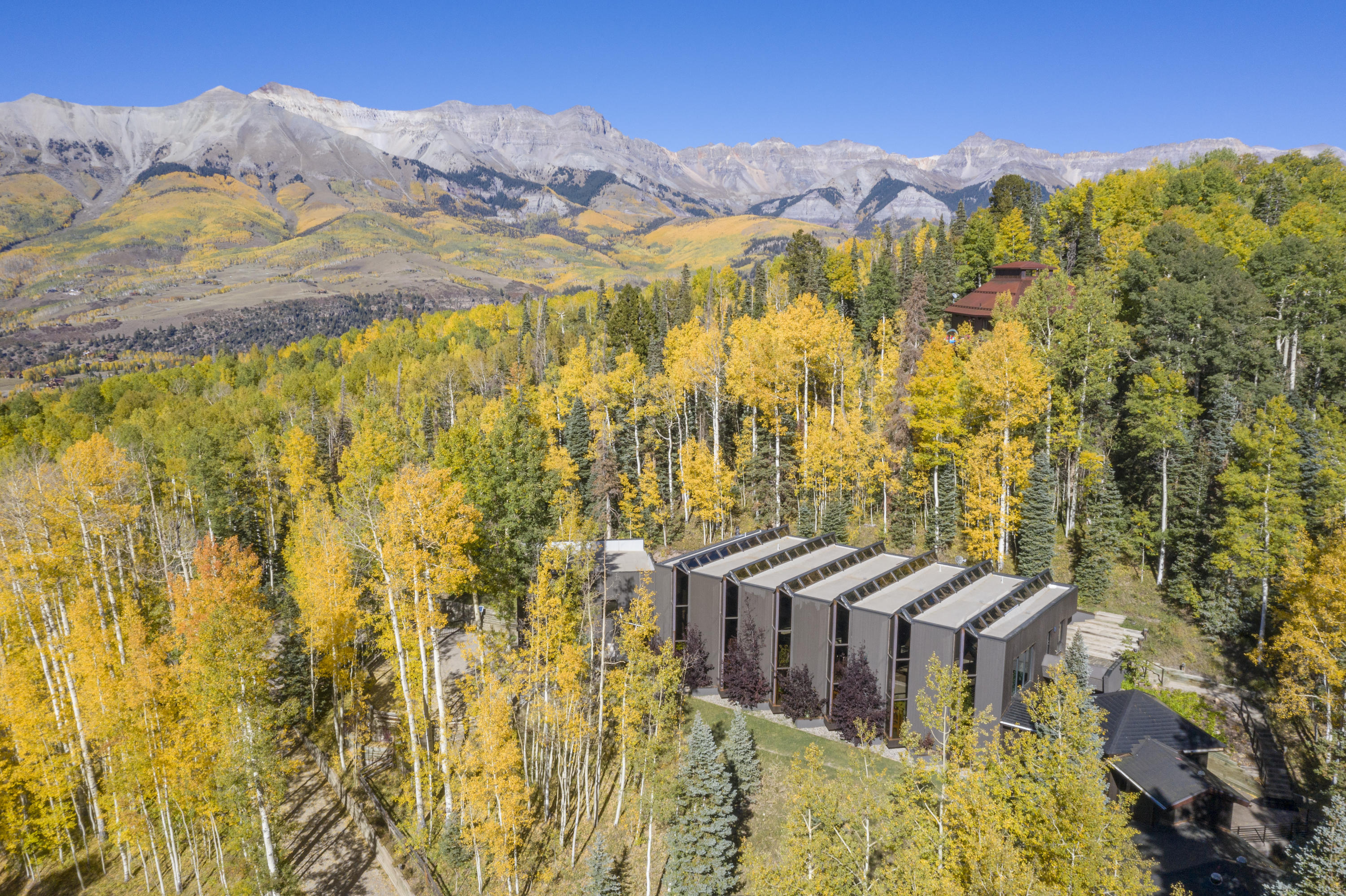 24 Sunset Circle Telluride, CO 81435 - Photo 5 of 39 a view of residential houses with a swimming pool