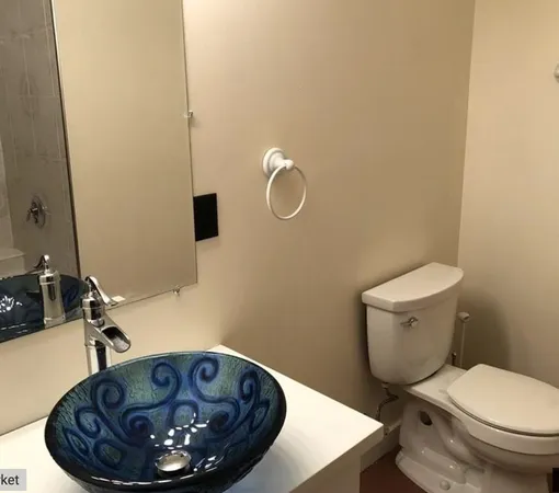 a bathroom with a toilet and a sink