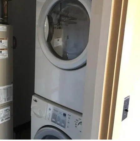 a close view of utility room with washer and dryer