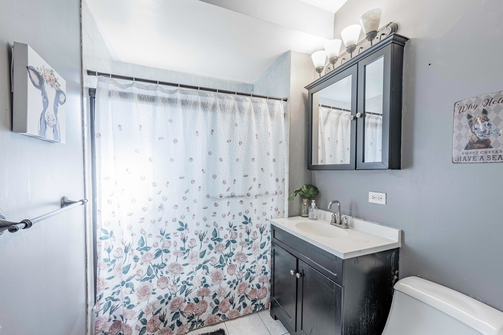 5844 West Maple Avenue Berkeley, IL 60163 - Photo 14 of 46 a bathroom with a sink toilet and shower