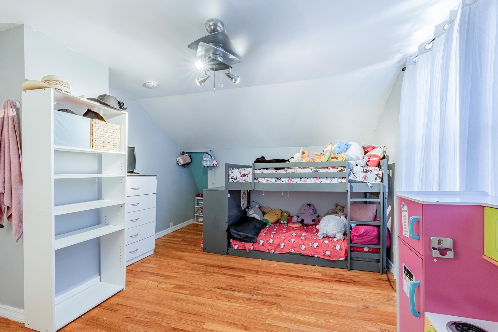 5844 West Maple Avenue Berkeley, IL 60163 - Photo 17 of 46 a bedroom with a bed and a chandelier