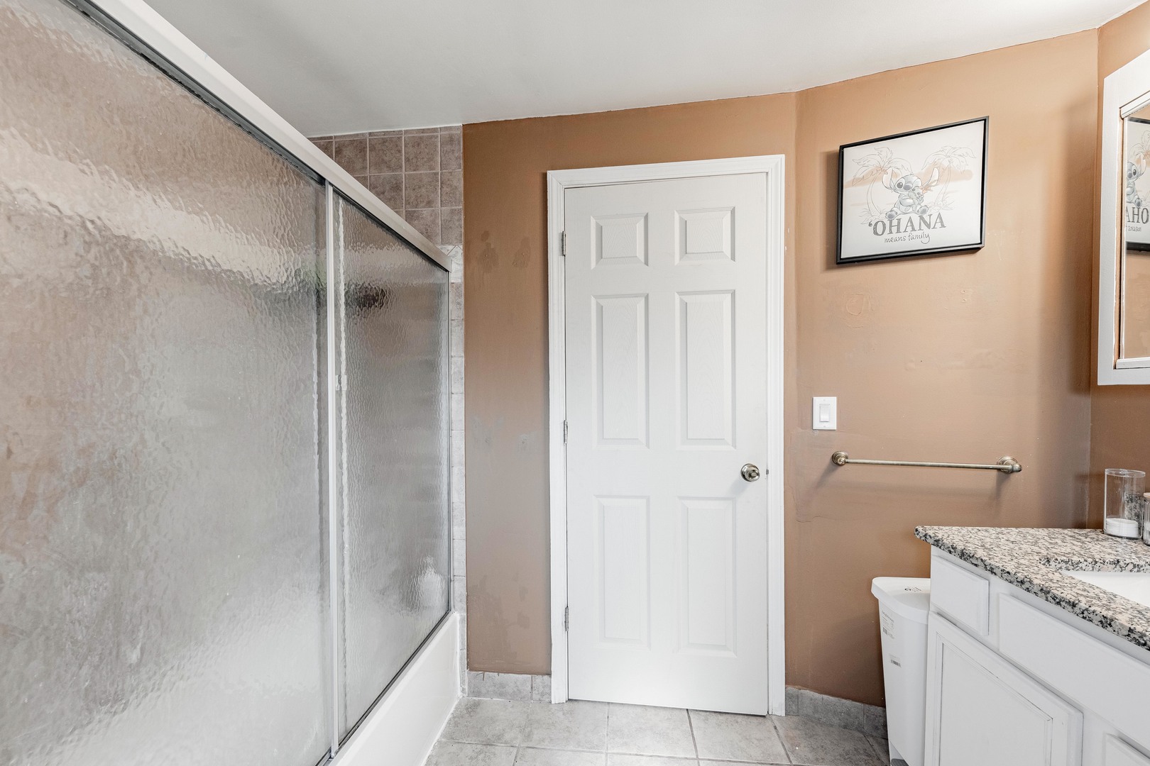 5844 West Maple Avenue Berkeley, IL 60163 - Photo 26 of 46 a bathroom with a granite countertop sink a mirror and a shower