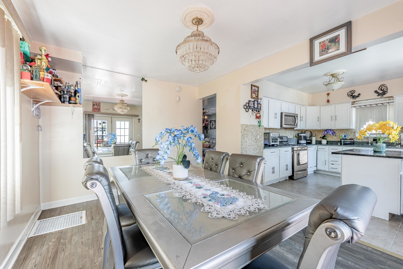 5844 West Maple Avenue Berkeley, IL 60163 - Photo 8 of 46 a view of dining room and kitchen island with furniture