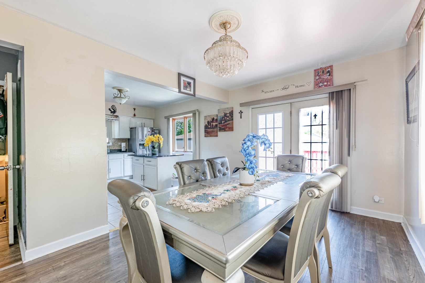 5844 West Maple Avenue Berkeley, IL 60163 - Photo 9 of 46 a view of a dining room with furniture window and wooden floor