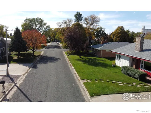 a view of a street with a houses