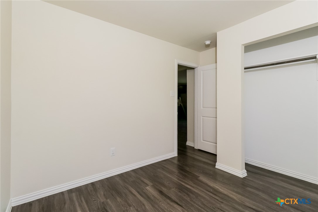 505 South 16th Street Temple, TX 76501 - Photo 15 of 21 a view of an empty room with wooden floor