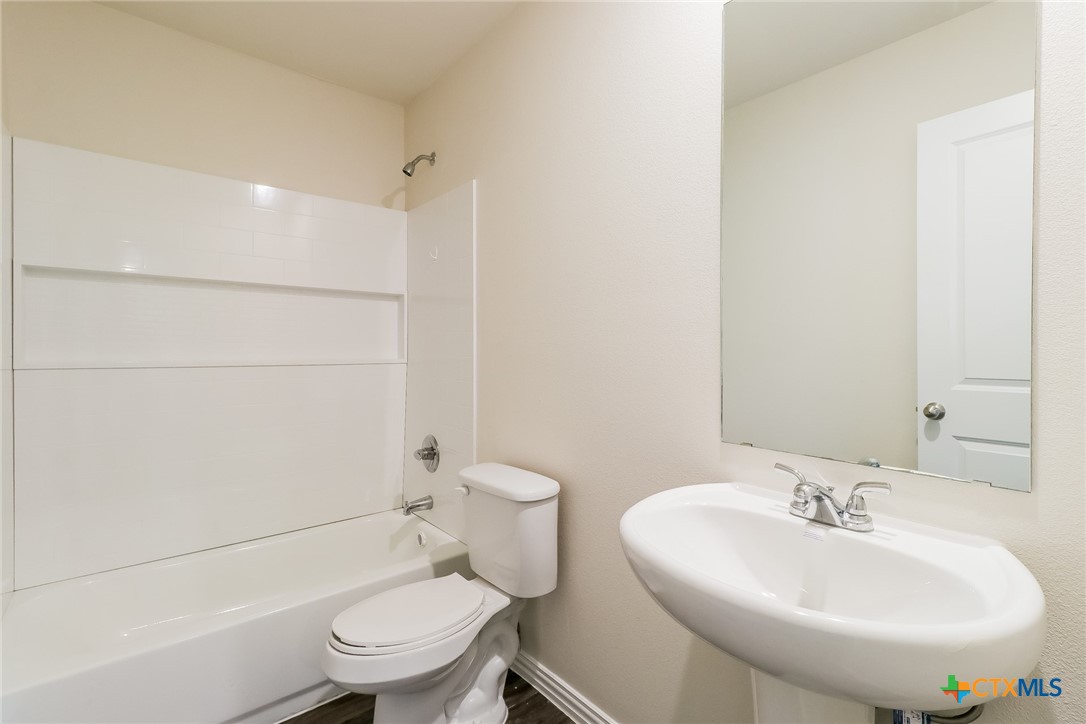 505 South 16th Street Temple, TX 76501 - Photo 19 of 21 a bathroom with a sink a toilet and shower