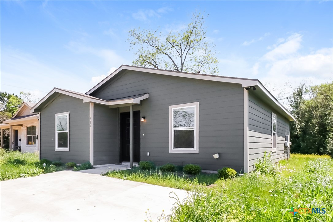 505 South 16th Street Temple, TX 76501 - Photo 2 of 21 a front view of a house with a yard