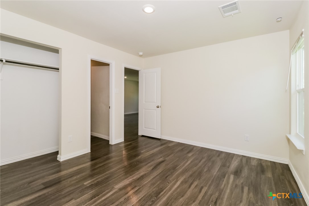 505 South 16th Street Temple, TX 76501 - Photo 9 of 21 a view of an empty room with wooden floor