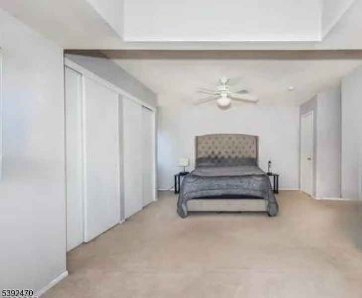 216 Woods Edge Drive Succasunna, NJ 07876 - Photo 11 of 13 a living room with furniture and a chandelier