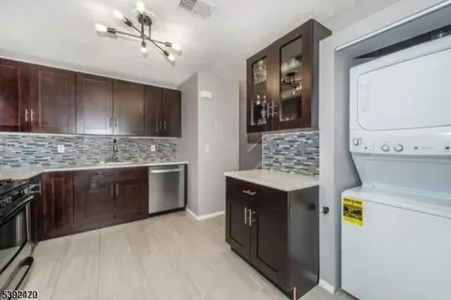 a kitchen with a stove and a refrigerator