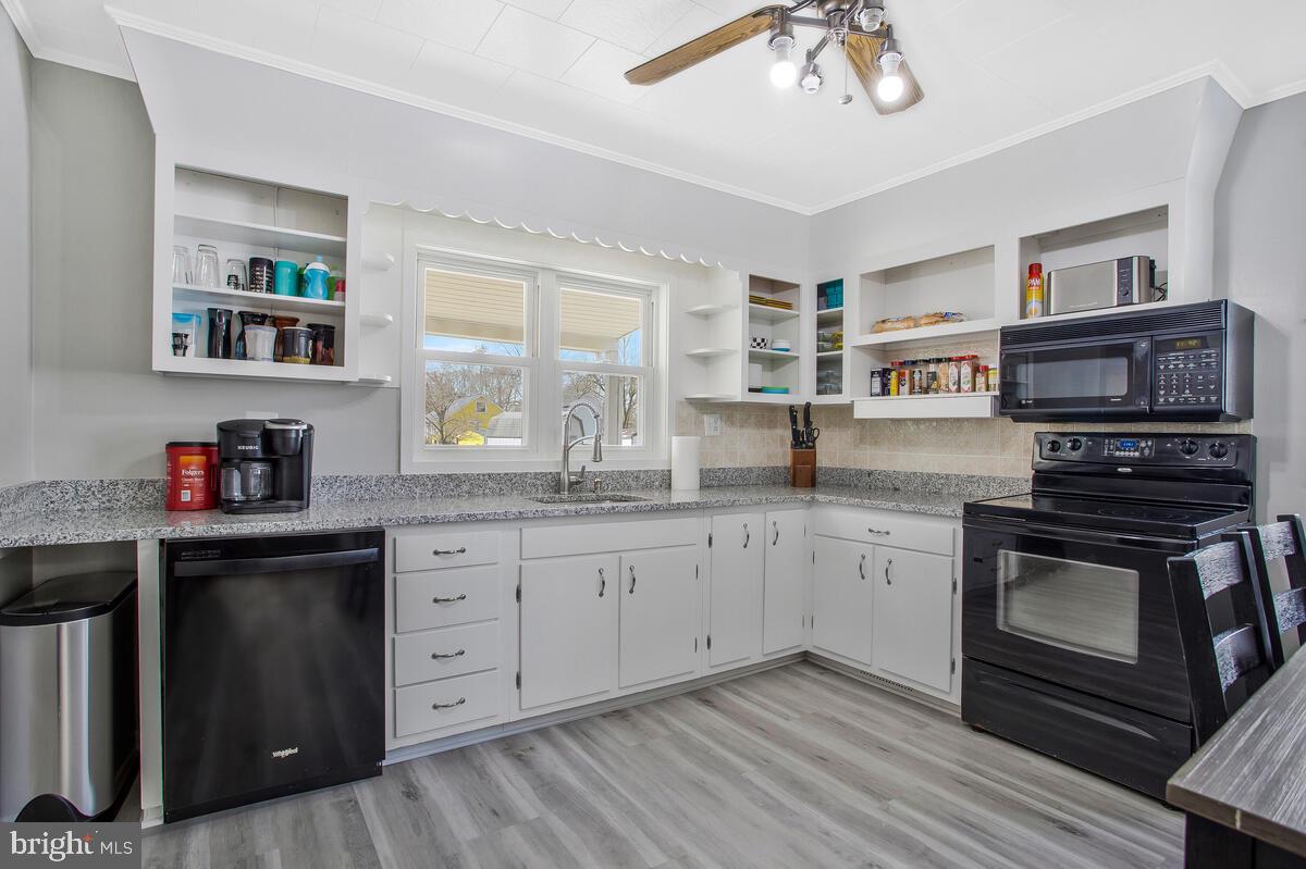 8130 Edgewater Road Baltimore, MD 21226 - Photo 11 of 39 NEW Luxury Vinyl Plank Kitchen Floor