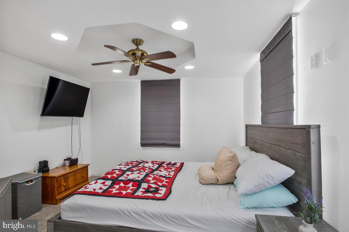 8130 Edgewater Road Baltimore, MD 21226 - Photo 21 of 39 Main Level Primary Bedroom w/ ceiling fan