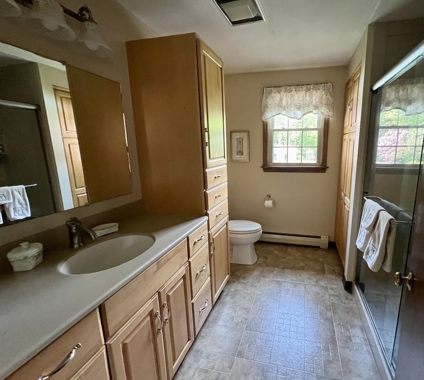 22 Franklin Road Gill, MA 01354 - Photo 21 of 28 a bathroom with double vanity sink a mirror and a toilet