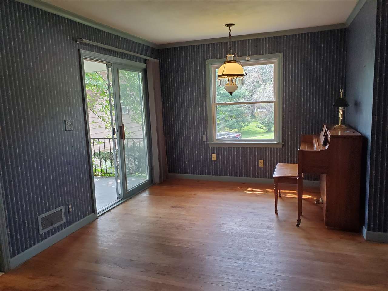 1527 Rural Street Rockford, IL 61107 - Photo 3 of 13 an empty room with wooden floor and windows