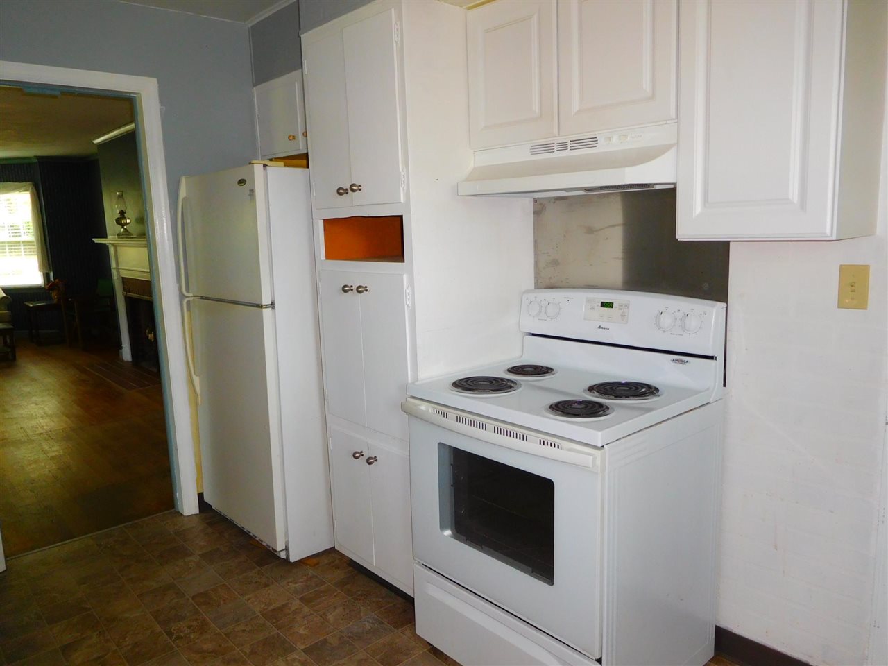 1527 Rural Street Rockford, IL 61107 - Photo 5 of 13 a stove top oven sitting inside of a kitchen
