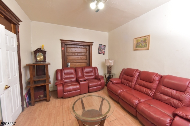 240 Clinton Avenue Jersey City, NJ 07304 - Photo 4 of 14 a living room with furniture a walk in closet and a window