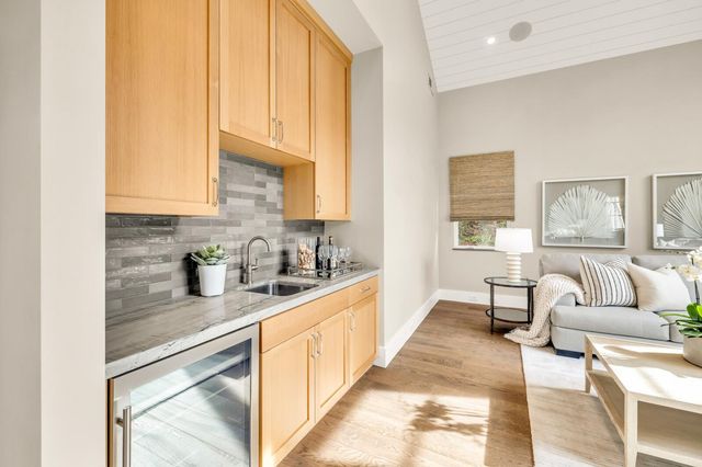 a kitchen with stainless steel appliances granite countertop a sink and cabinets