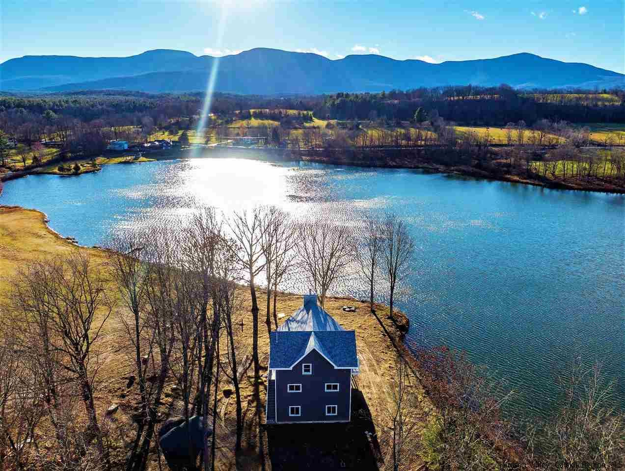 133 Rockefeller Lk Road Cairo, NY 12413 - Photo 1 of 35 a view of a lake with a mountain in the background