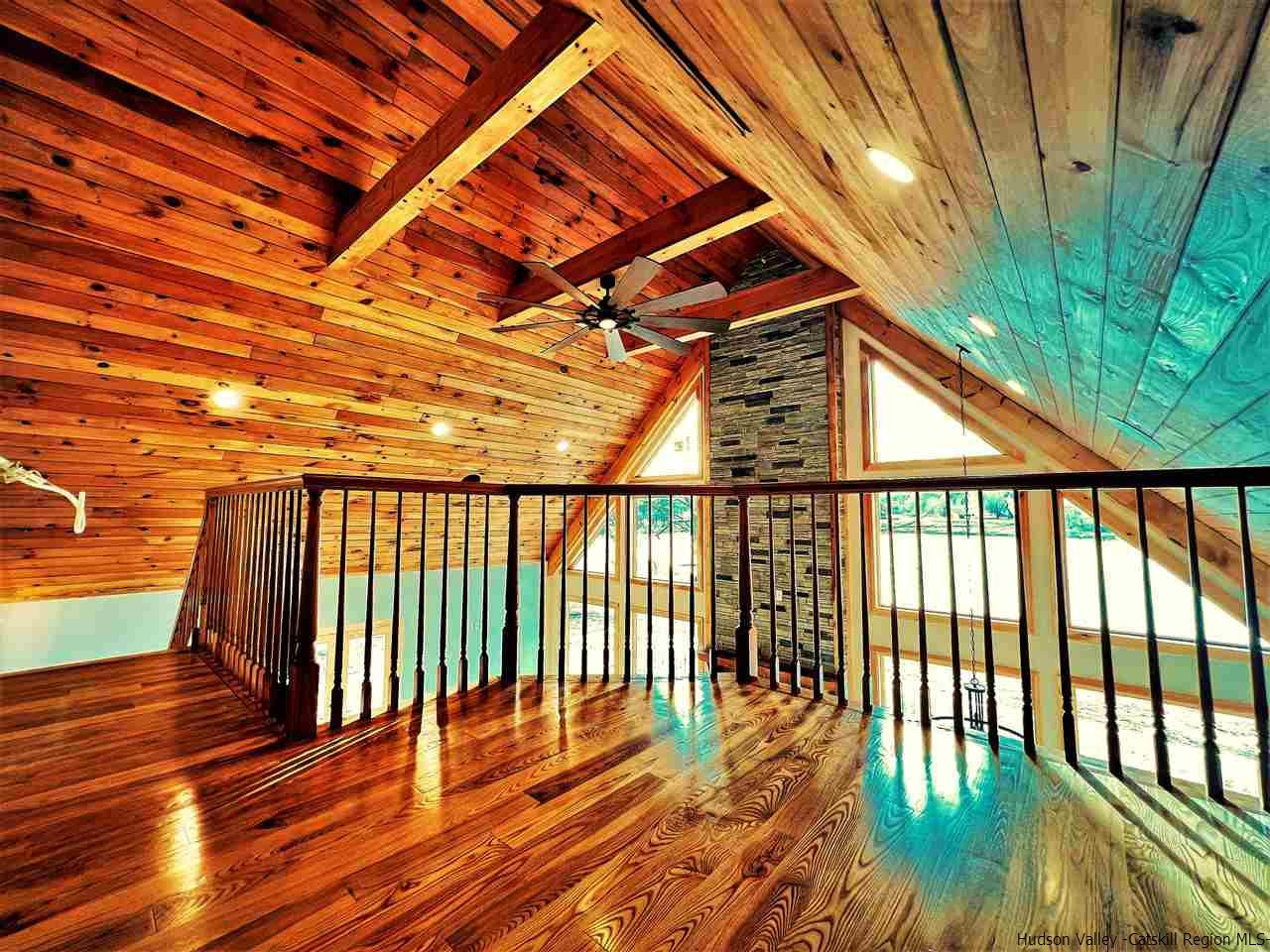 133 Rockefeller Lk Road Cairo, NY 12413 - Photo 12 of 35 a balcony with wooden floor