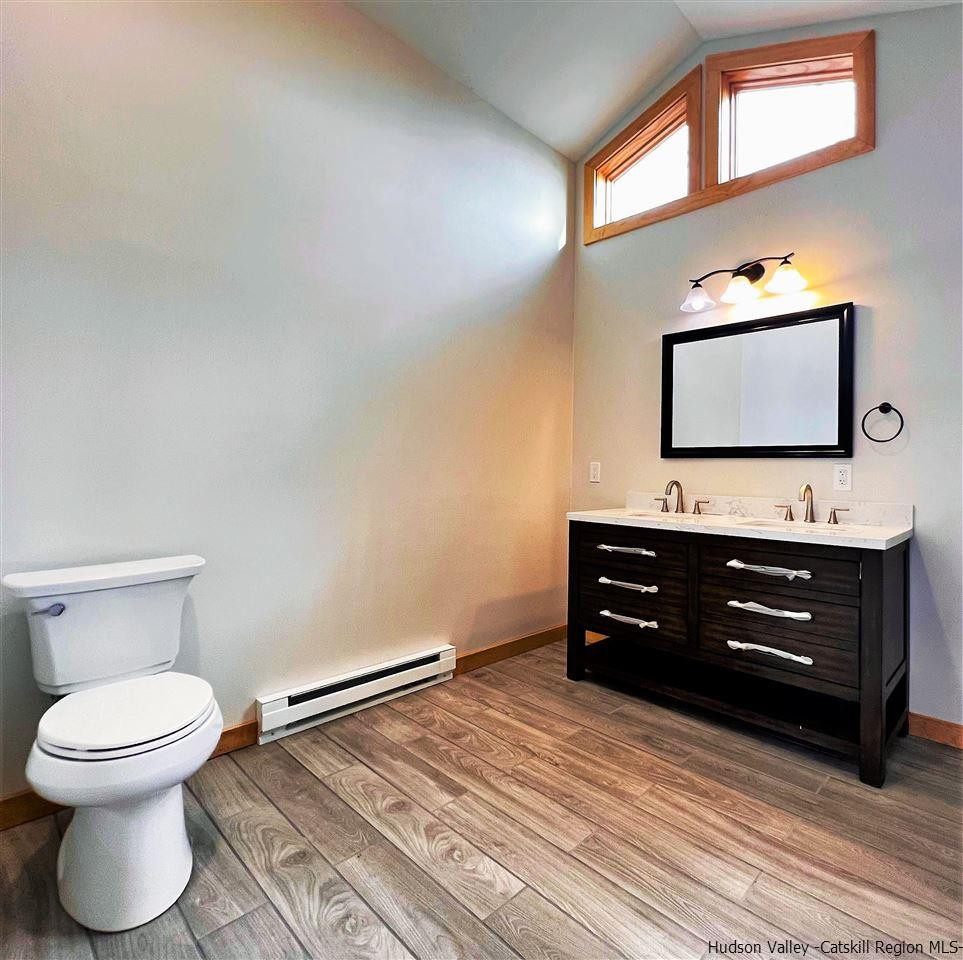 133 Rockefeller Lk Road Cairo, NY 12413 - Photo 19 of 35 a bathroom with a toilet sink and mirror