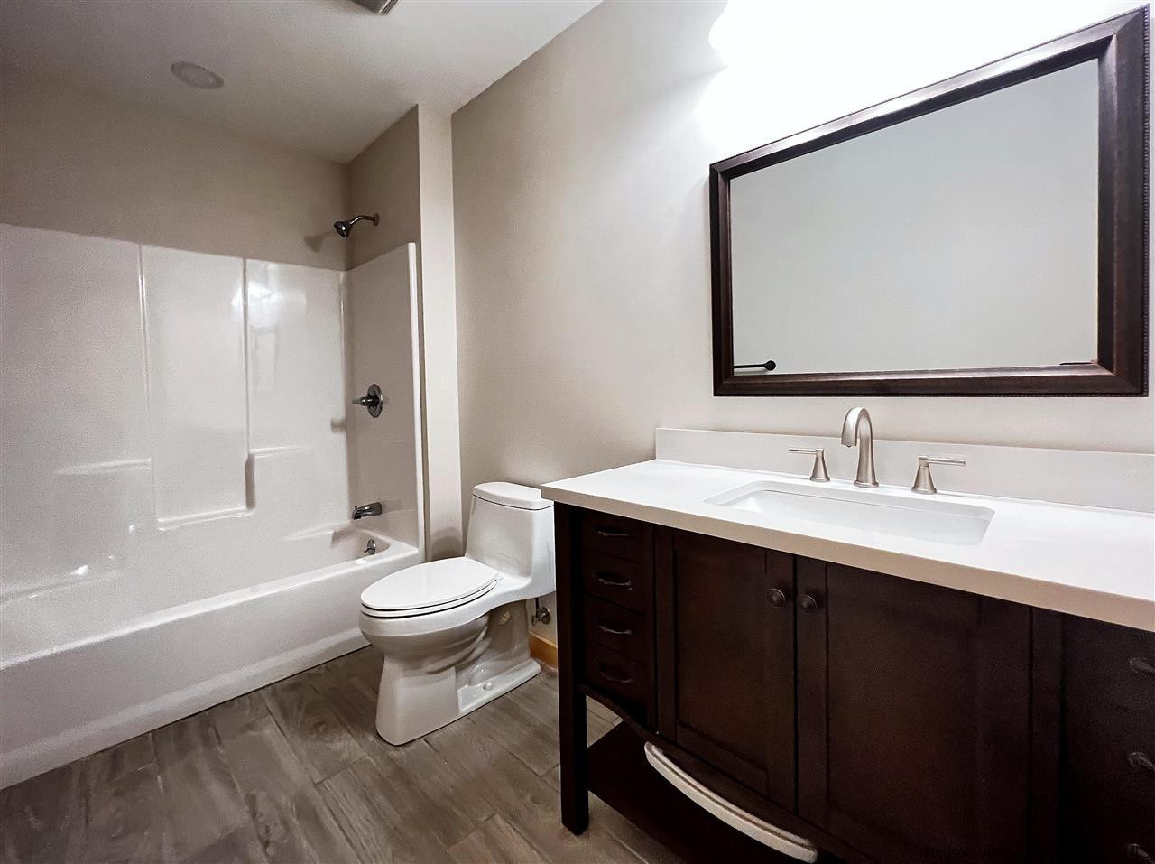 133 Rockefeller Lk Road Cairo, NY 12413 - Photo 20 of 35 a bathroom with a double vanity sink toilet and shower