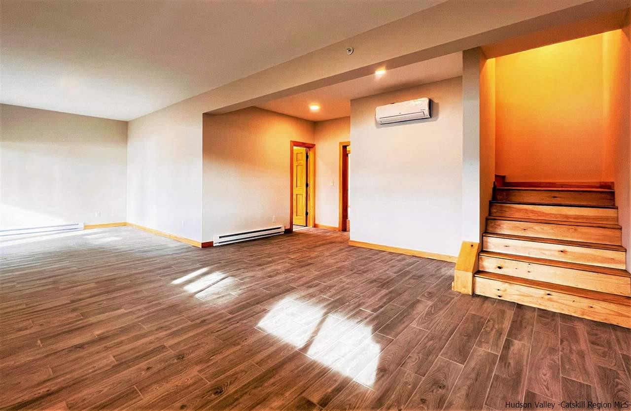 133 Rockefeller Lk Road Cairo, NY 12413 - Photo 25 of 35 a view of empty room with wooden floor and fan
