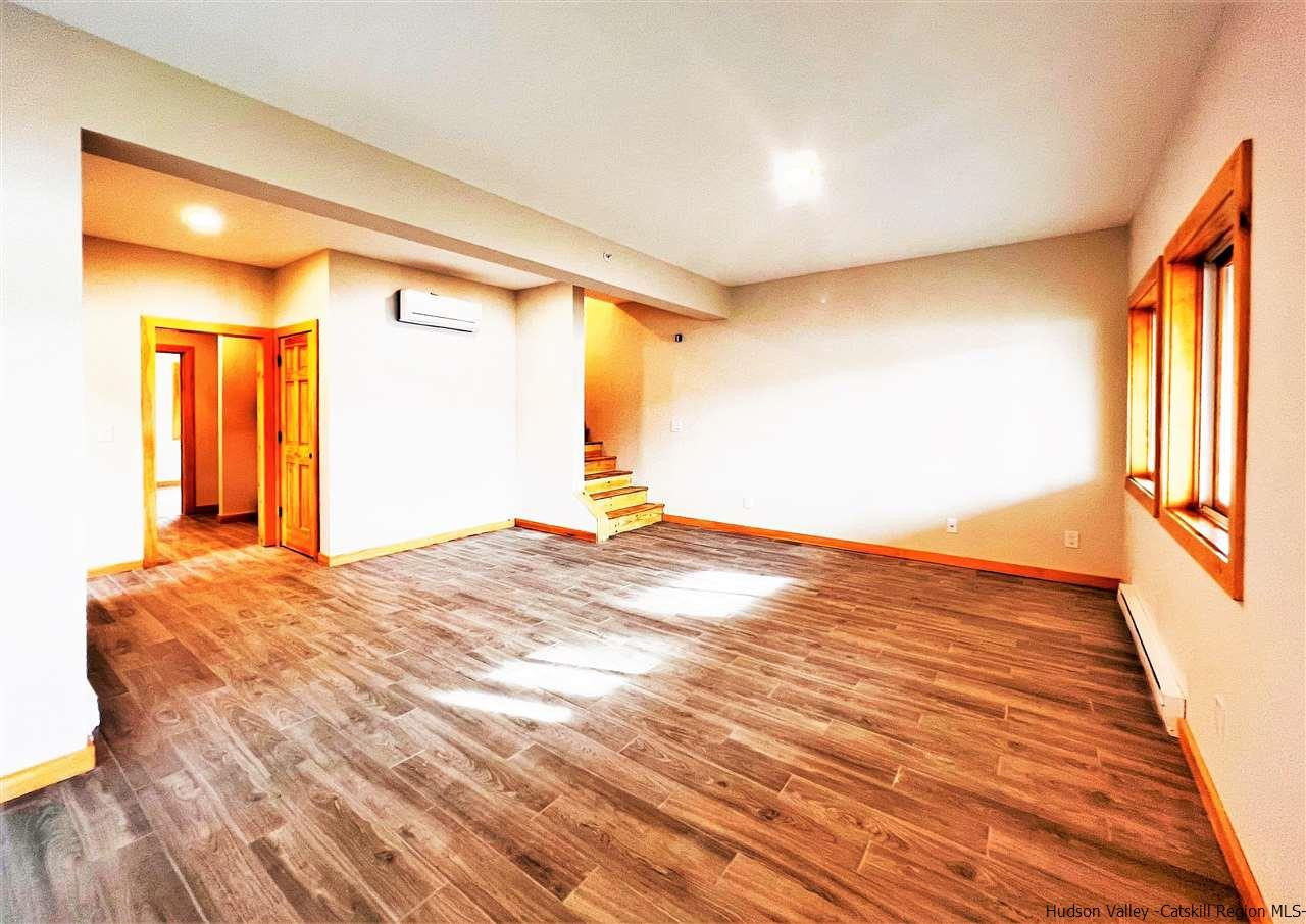 133 Rockefeller Lk Road Cairo, NY 12413 - Photo 27 of 35 a view of empty room with wooden floor and fan