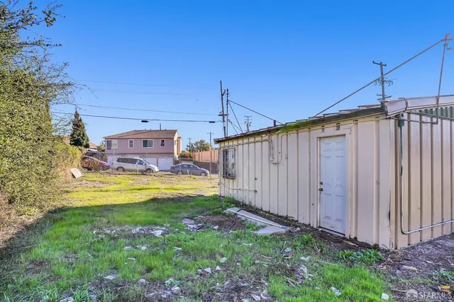 a swimming pool with some trees in the background
