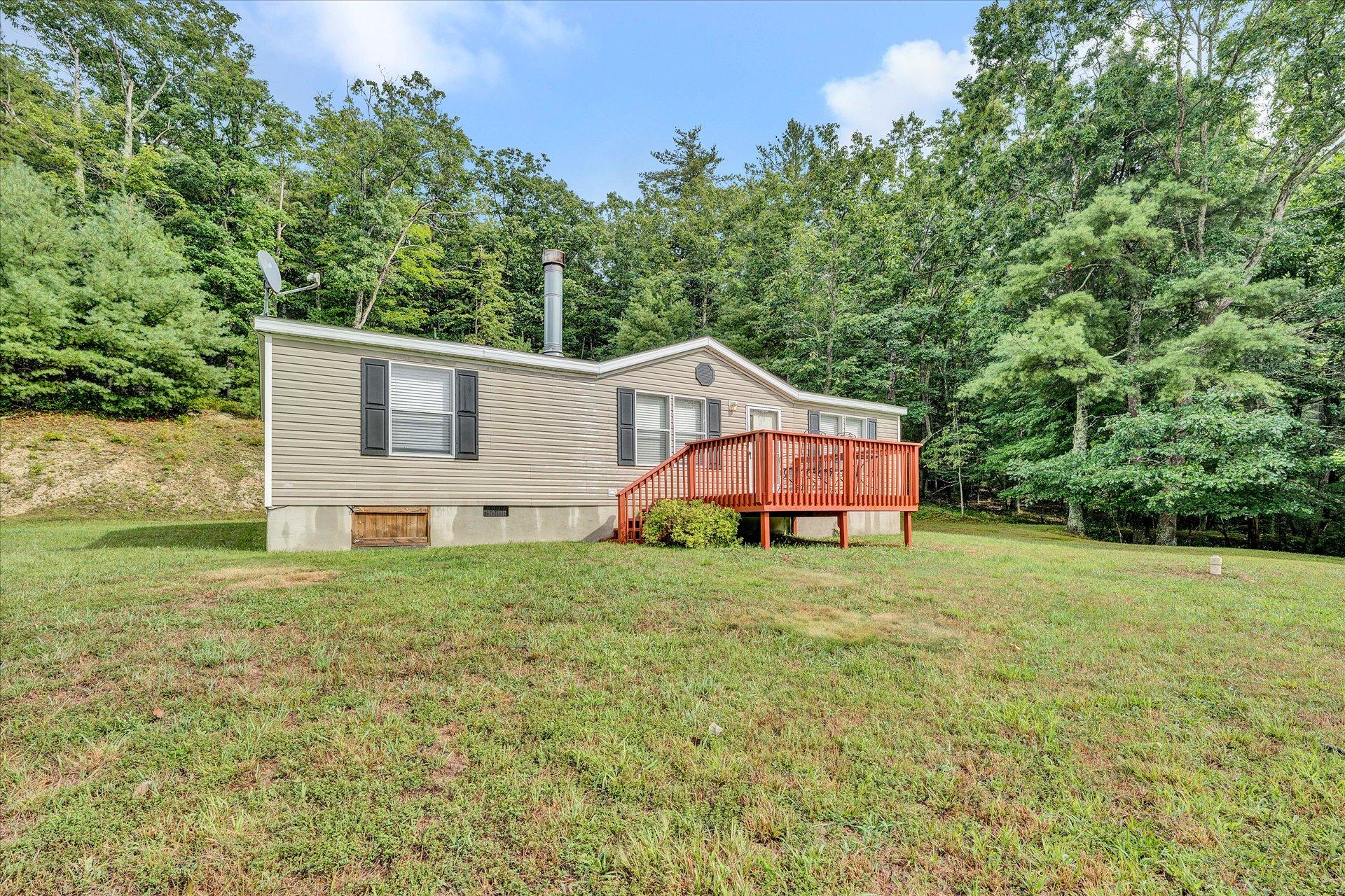 4120 Sunflower Road Pilot, VA 24138 - Photo 3 of 35 a house with a tree in front of it
