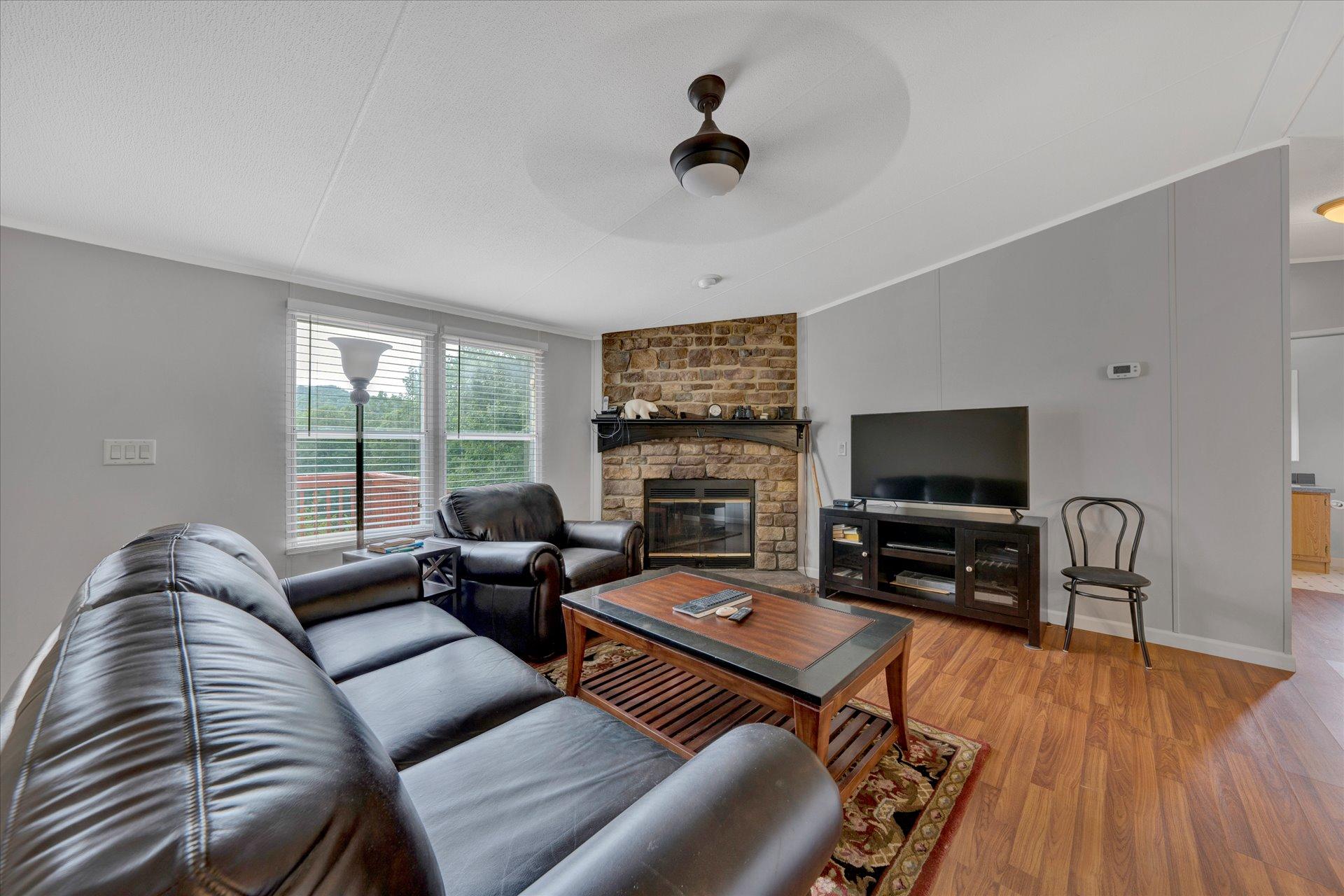 4120 Sunflower Road Pilot, VA 24138 - Photo 7 of 35 a living room with furniture and a flat screen tv