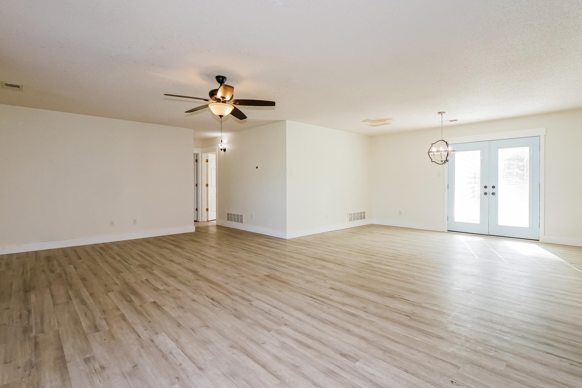 188 David Reed Drive Munford, TN 38058 - Photo 4 of 20 Spacious room featuring light wood-finish flooring, white walls, and a ceiling fan with integrated lighting