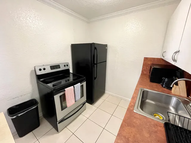 a kitchen with a stove and a microwave