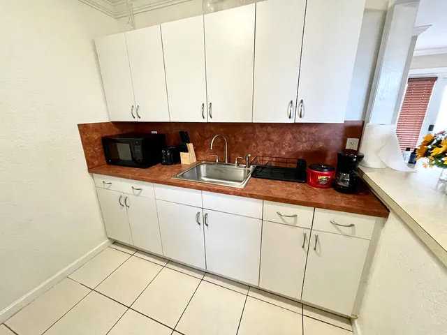 a kitchen with a sink and cabinets