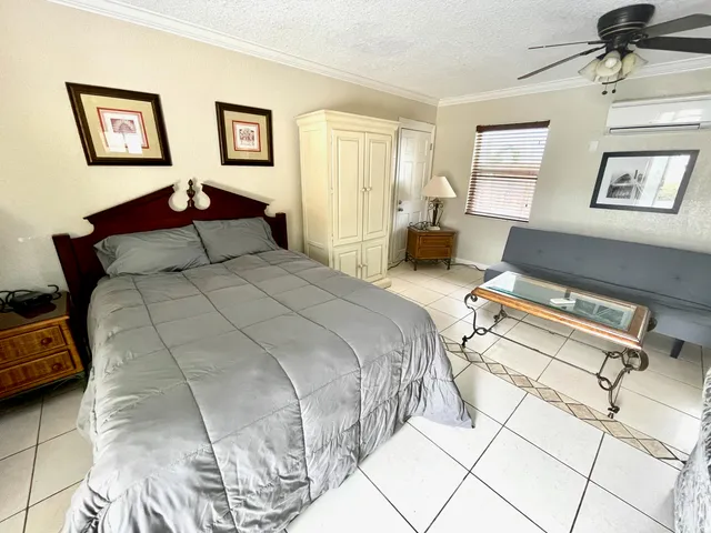 a bedroom with a bed and a couch