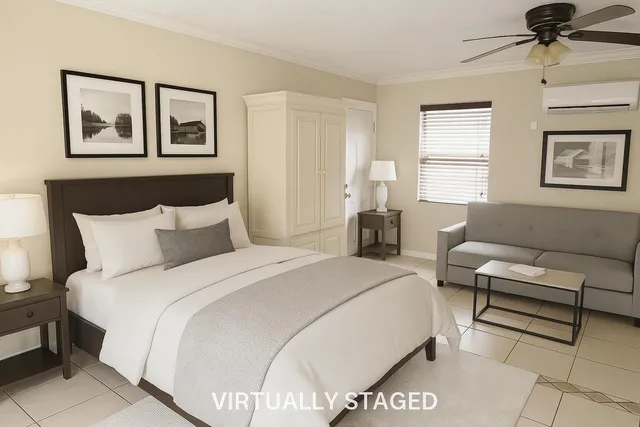 a bedroom with a bed and a couch