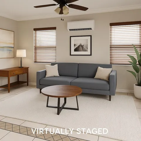 a living room with furniture and a window