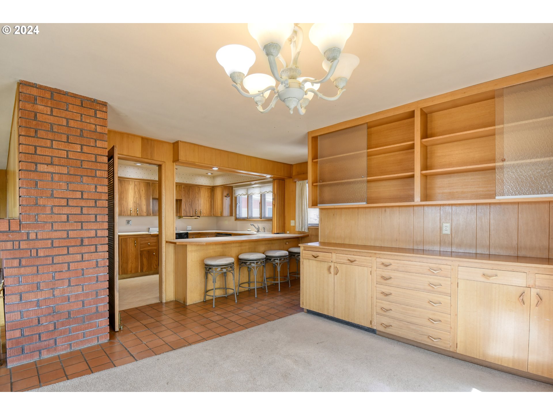 405 Northwest Johns Lane Pendleton, OR 97801 - Photo 12 of 48 a kitchen with a cabinets and chandelier